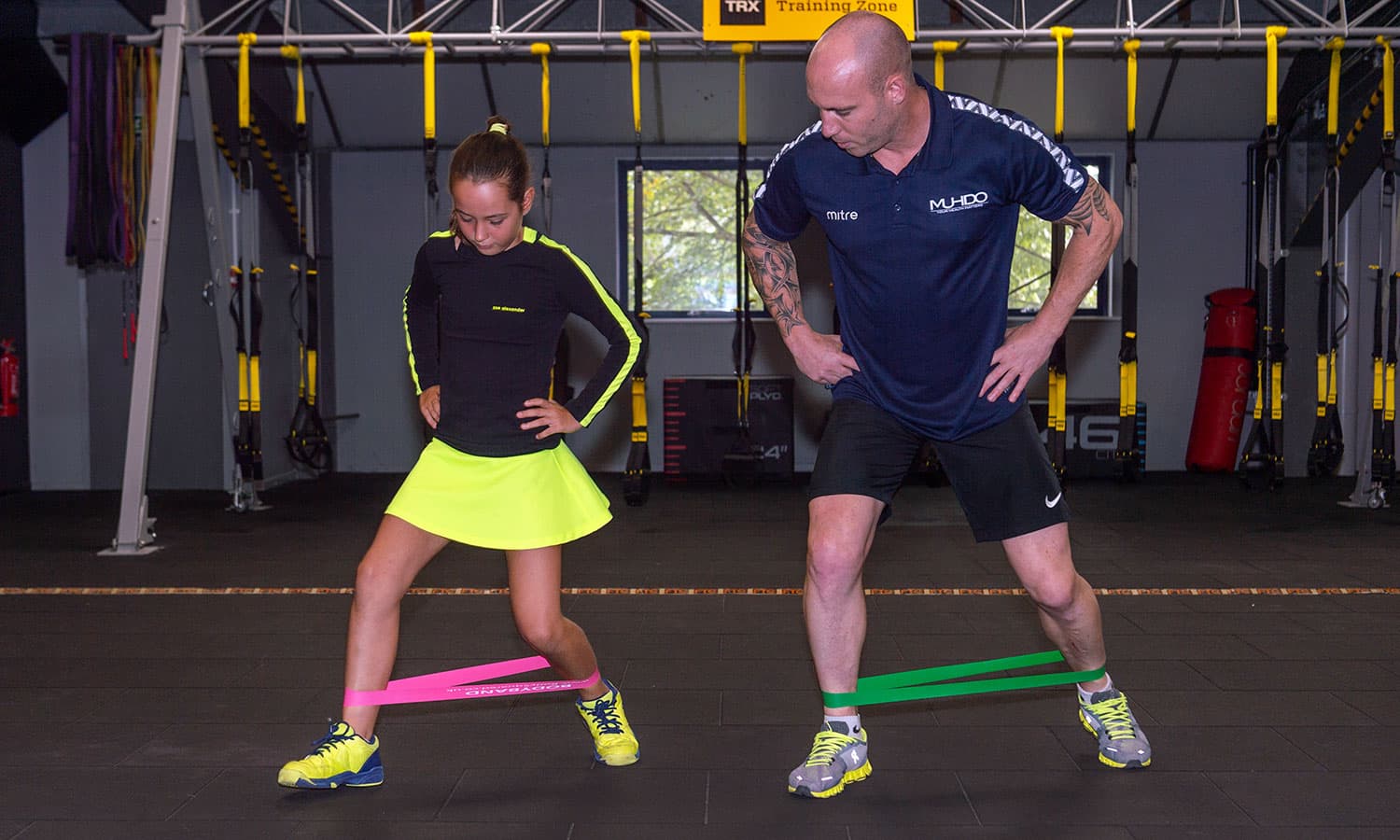 Athletes training with resistance bands